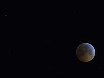 total eclipse of the moon with a planet in the background Total Eclipse of the moon