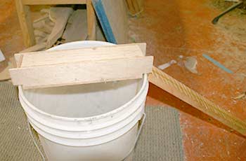 Mouse trap in position over the bucket