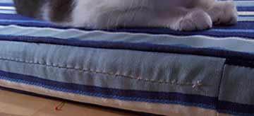 Cushion opening sewed shut